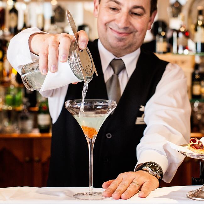 Mr Joaquim Veras, Head Barman preparing cocktails.