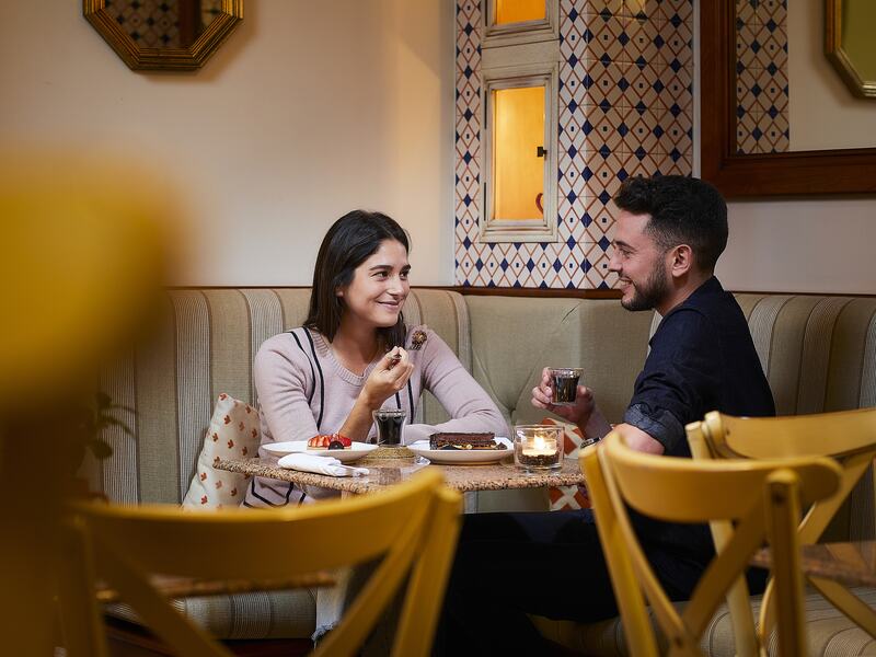 Couple having dinner at Adega Restaurant.