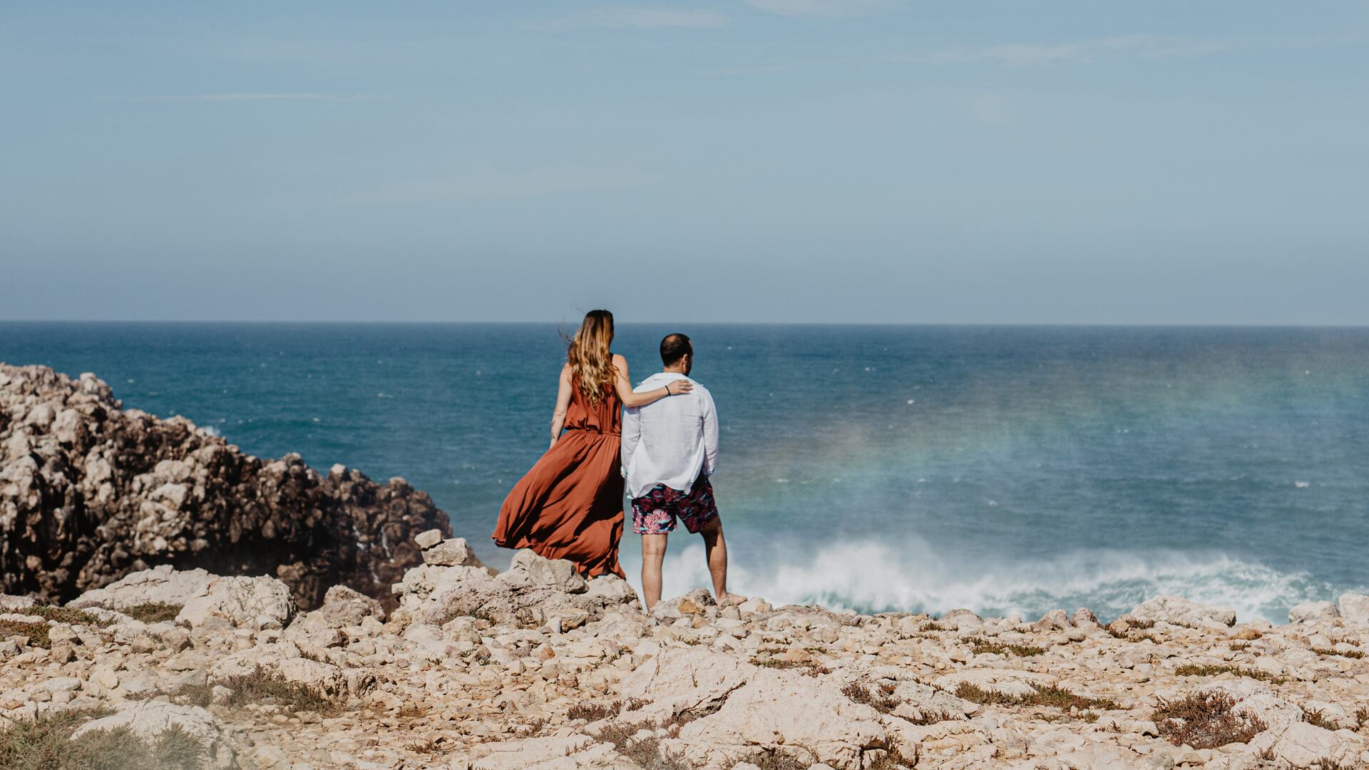 Beyond the resort: Couple enjoying sea view.