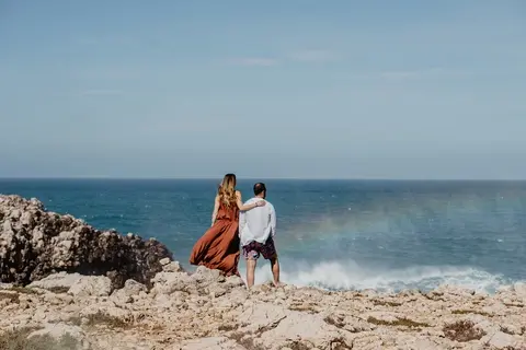 Beyond the resort: Couple enjoying sea view.