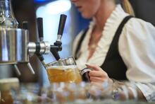 Oktoberfest Staff pouring beer