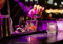 Bartender serving drinks at V-club