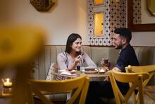 Couple having dinner at Adega Restaurant.