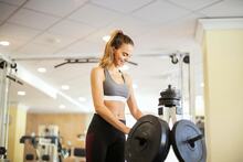 Health Club & Gym: Woman exercising.